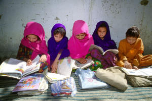 Girls learn to read - copyright CAI