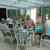 Family barbeque dinner in the sunroom