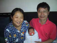 Newborn Nina with mom Connie and dad Mark