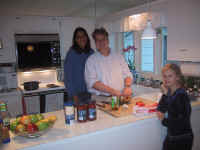 Parul and Nate teaching the art of cooking vegetarian